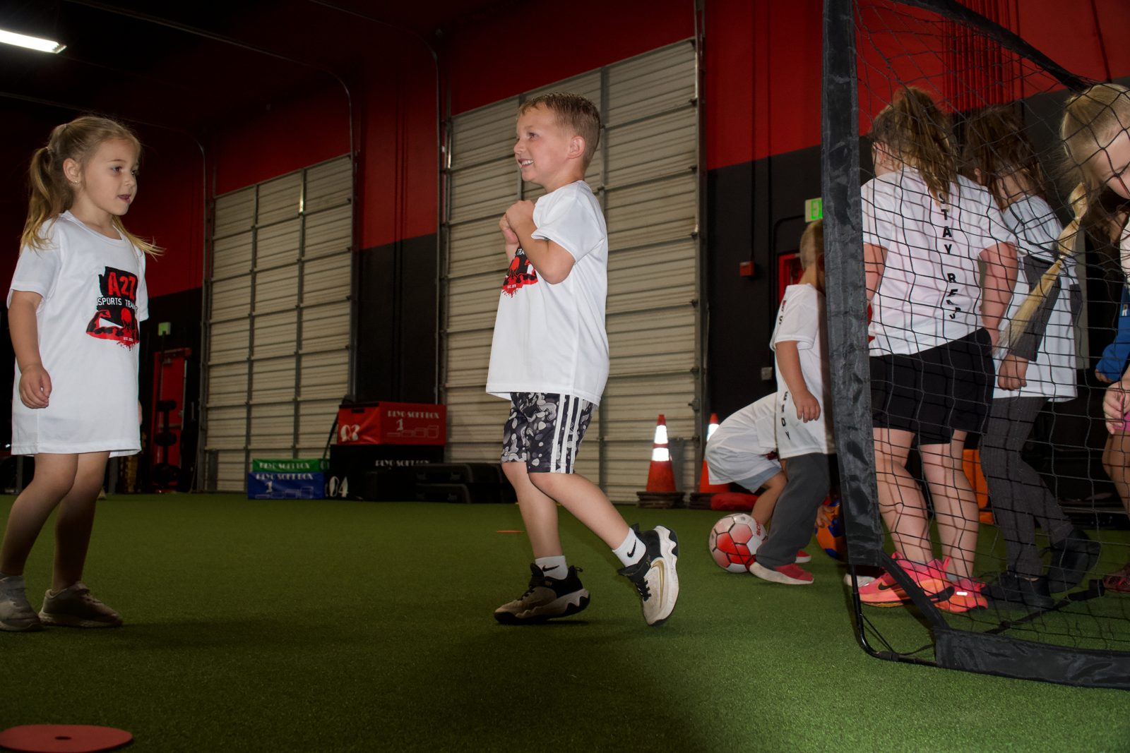 Young athletes in a coached session on the indoor turf at A2Z Sports Training